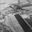 Oblique aerial view centred on the village, taken from the WNW.