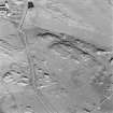Oblique aerial view of Totronald centred on two standing stones, taken from the SW.