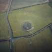 Oblique aerial view centred on the remains of the recumbent stone circle, taken from the N.