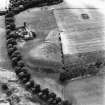Waulkmill, oblique aerial view, taken from the N, centred on the cropmarks of a fort.