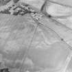 Oblique aerial view centred on the cropmarks of an enclosure, pits, a possible enclosure and possible pit-defined enclosure, taken from the W.