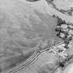 Oblique aerial view centred on the cropmarks of an enclosure, pits, a possible enclosure and possible pit-defined enclosure, taken from the NE.