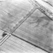 Oblique aerial view of Over Benchill centred on a series of linear cropmarks, taken from the WSW.