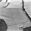 Oblique aerial view centred on the cropmarks of the Cleaven Dyke, taken from the WNW.