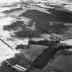 Oblique aerial view centred on the remains of the cursus with  linear cropmarks and possible hollow-ways adjacent, taken from the WNW.