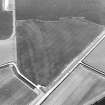 Oblique aerial view centred on the cropmarks of the enclosures, possible ring-groove houses, the possible souterrain, rig and pits, taken from the NE.