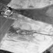 Kirkton Mill, oblique aerial view, taken from the SE, centred on the cropmarks of a round house and rig.