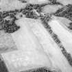 Oblique aerial view centred on the cropmarks of the possible plantation enclosure with the gate-lodge adjacent, taken from the S.