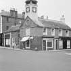 View of the former Town House, High Street, Moffat, from south west, showing the premises of Wallace Bros. Butchers and the Moffat Toffee Shop.