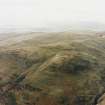 Oblique aerial view of Alva Glen centred on the remains of cultivation terraces, taken from the SE.