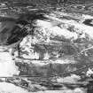 Oblique aerial view of Edinburgh, centred on Holyrood Park, taken from the SE.