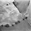 Oblique aerial view centred on the cropmarks of the settlement, taken from the WSW.