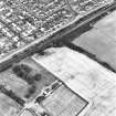 Bankton, oblique aerial view, taken from the SSW, centred on cropmarks. Bankton country house is visible in the bottom left-hand corner of the photograph.