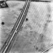 Howe Mire, cropmarks, coal pits and field boundary: oblique air photograph