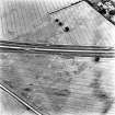 Howe Mire, cropmarks, coal pits and field boundary: oblique air photograph