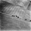 Crichton House, oblique aerial view, taken from the SE, centred on the cropmarks of two sides of a possible enclosure.