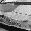 Oblique aerial view of Fishwick Mains centred on the cropmarks of a settlement, taken from the S.