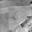 Oblique aerial view centred on the remains of the fort, taken from the NW.