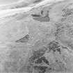 Oblique aerial view centred on the remains of the fort, taken from the ENE.