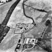 Holywood Abbey, oblique aerial view, taken from the WNW, centred on the cropmarks around the Abbey, and showing linear cropmarks in the top right-hand corner of the photograph.