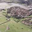 Oblique aerial view of Berwick-upon-Tweed centred on the town and the remains of the town wall and bastions, taken from the N.