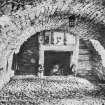 Photographic copy of postcard view of vaulted chamber.