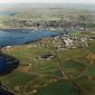 Oblique aerial view from NW, with Kirkwall in the background.