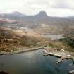Aerial view of Lochinver, Assynt, looking SE.
