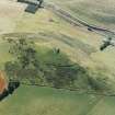 Oblique aeriaL showing tower house at Dunnideer, Aberdeenshire 