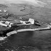 Aerial view showing the castle, bridge, mausoleum and dovecot at Freswick.