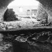 Excavation photograph - Cellar 107 in foreground of main cellar Area B