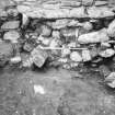 Excavation photograph : upper level of debris within doorway on S side of tower, from N.