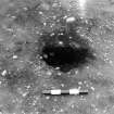 Excavation photograph : trench III - posthole AFH, half sectioned, part of post structure A.