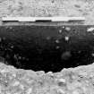Excavation photograph : trench IV - feature DAA, posthole, half sectioned.