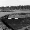 Excavation photograph : trench IV - feature DAH, radial section cut 13/13x.