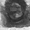 Excavation photograph.  F13 removal of fill. Pot shows much of base missing.