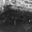 Excavation photograph showing area G and possible flooring or walling in SW corner sealing lower clay layer 116 and 117 and coal yard level at Edinburgh Castle