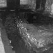 Excavation photograph : area G - S half of area after revealing N side of footing 115 retaining wall, poss cut 131 at E end.