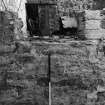 Excavation photograph : area G/K - detail of bottom of south (window) opening in east detention cell wall showing sill of small inserted window.