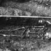 Excavation photograph : area M - skeleton in grave cut 1127 in NW part of area adjacent to Gas House.