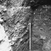 Excavation photograph : area T - close up of midden deposits at the bottom of the trial trench.