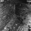 Excavation photograph : area L - relationship between wall 816 and cobbles 837.