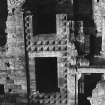 Excavation photograph : Italianate facade extending into the N end of west range, from E.