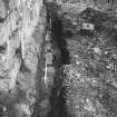 Yester, St Bathan's Chapel (Yester Chapel): Excavation photograph - Trench 4 with gravestone removed - from S