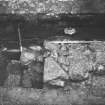 Yester, St Bathan's Chapel (Yester Chapel): Excavation photograph - Wall footings in the N end of Trench 4 - from E
