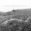 From the N, the chapel on Nave island, the walls were repaired in 1785 and the tall chimney was built for the purposes of kelp burning.