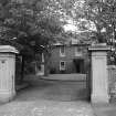 View of Barns House, Ayr, through gateposts from north east.