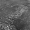 Oblique aerial view showing Howe Mire, settlement, coal sinks and cropmarks.