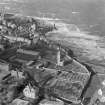 Oblique aerial view of St Andrews including Castle and Cathedral.