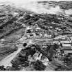Photographic copy of 1947: Oblique aerial view from west-south-west of Ardeer, showing Administration buildings (centre), Africa House (foreground), and central area of factory (nitro-cellulose, acids etc) in middle distance.  (See also Overlay 'A' for details [D 10465]).